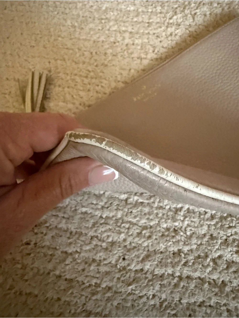 Kate Spade pebbled leather tassel clutch/pouch in light beige